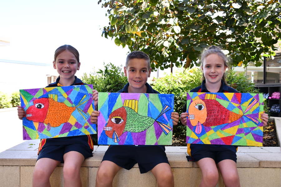 ART > Stella, Noah and Aisha with their creative but fishy artpieces.