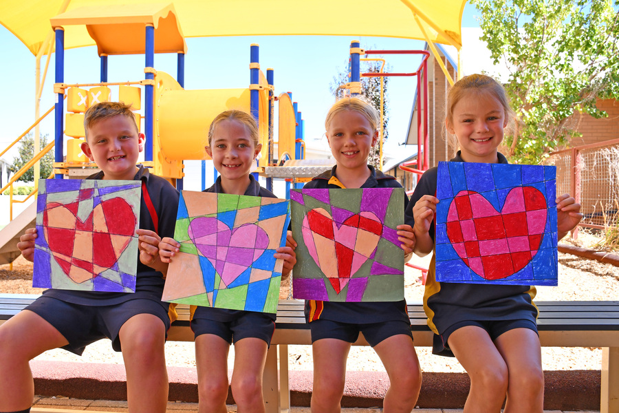 ART> Beau, Lucy, Isla and Indi with their love-themed heart artwork.