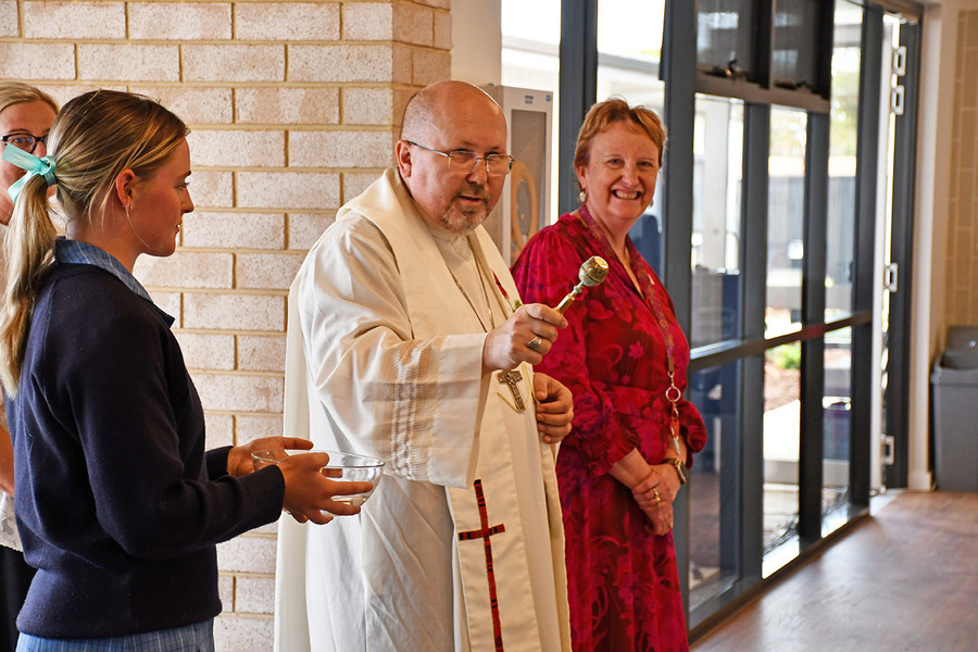 Bishop Karol Kulczycki SDS blesses the new recreation area at the St Mark’s Boarding House with Boarder Alex O’Neil and Principal Dr Sandra Hewson