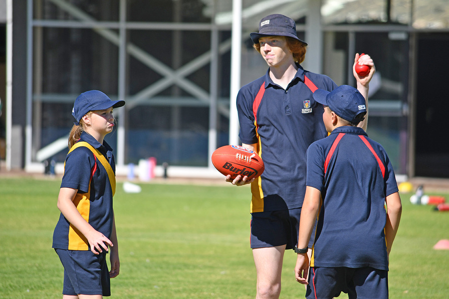 AFL > Year 11 students filled the role of umpires, scorers and coaches through a series of short games with our Year 5 and 6 students.
