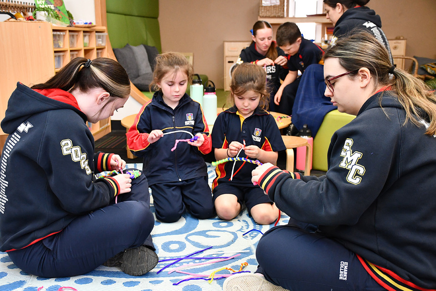 BUDDIES > Reception and Year 12 Buddies worked together to make serpents